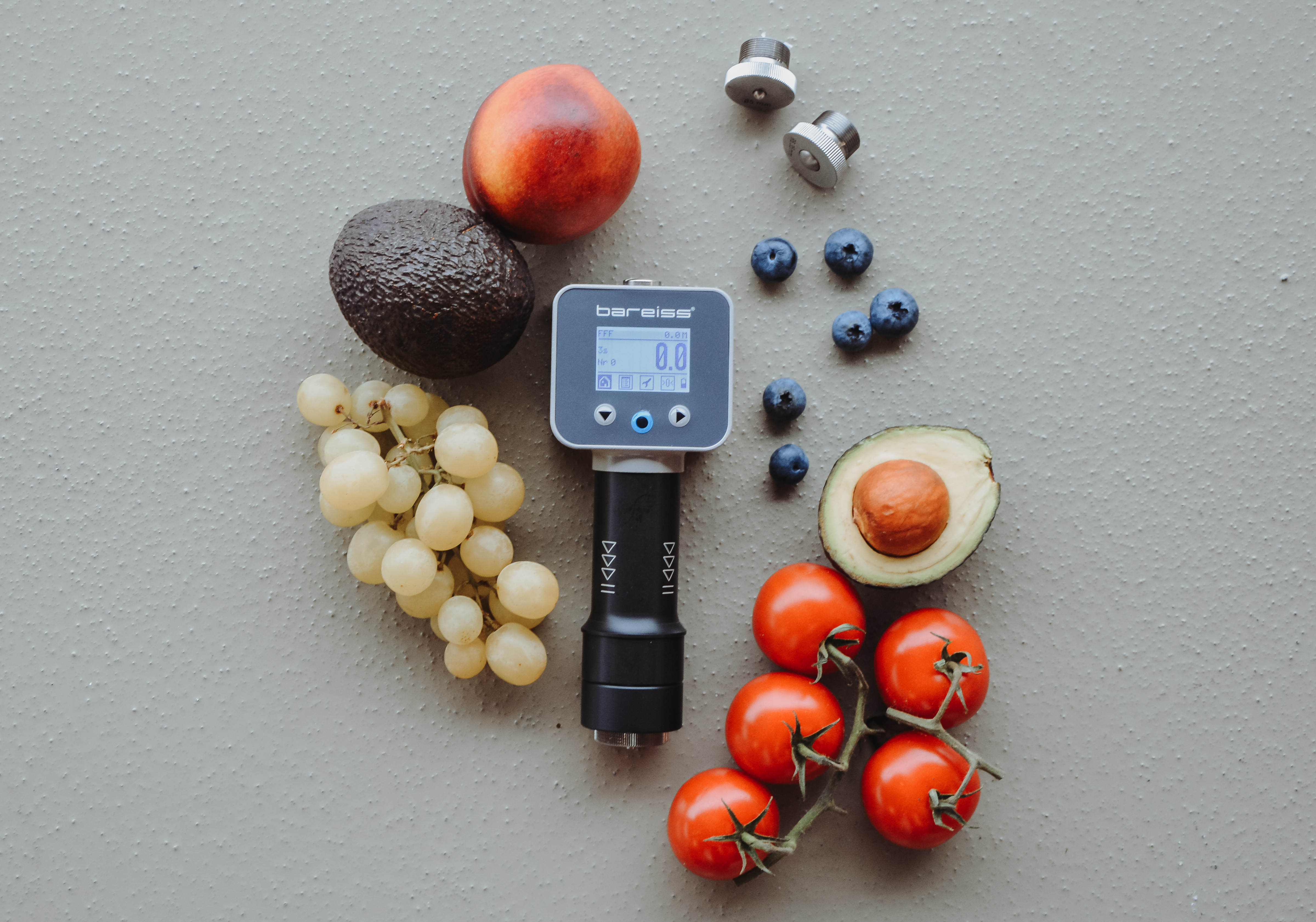 Digital handheld hardness tester HPE III Basic Fff with indenters and fruits